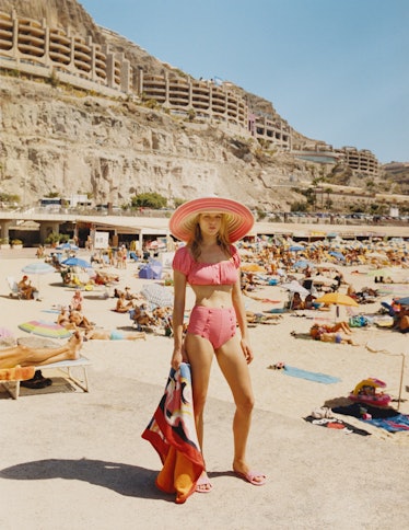 Lisa Marie Fernandez swimsuit; Missoni hat; Miu Miu sandals; Hermès towel.