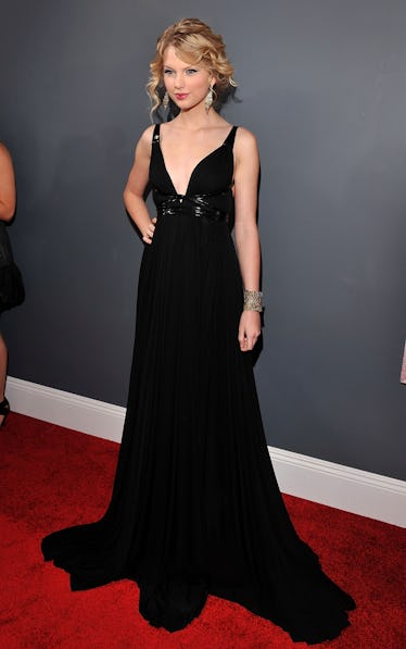 Taylor Swift at the 51st GRAMMYs in a black, low-cut KaufmanFranco dress