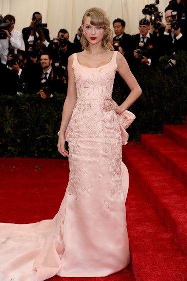 Taylor Swift at the Met Gala in a pink embroidered Oscar de la Renta gown