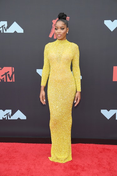 Keke Palmer at the 2019 MTV Video Music Awards in a shimmery, floor-length yellow Yousef Aljasmi gow...