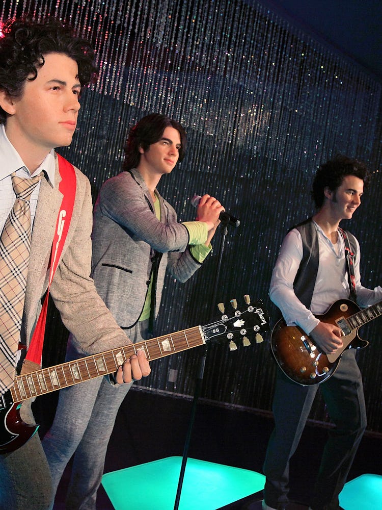 Wax figures of Nick Jonas, Joe Jonas, and Kevin Jonas of the Jonas Brothers at Madame Tussauds Holly...