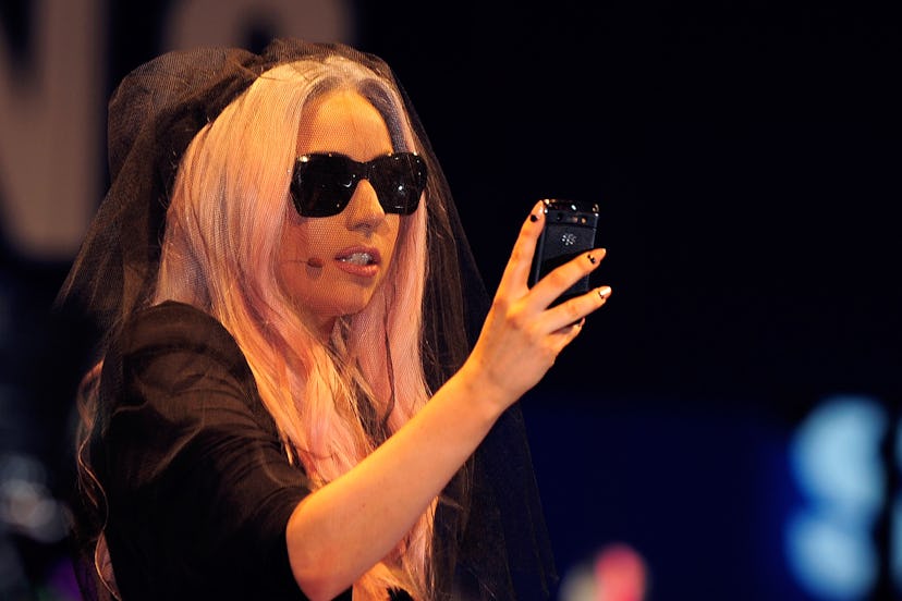 Lady Gaga holding a phone