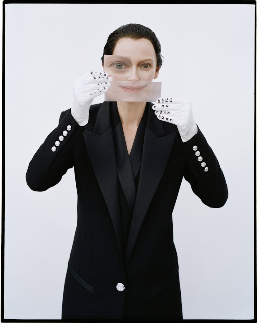 Tilda Swinton obscures her face.