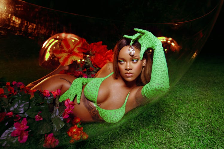 Rihanna posing for a photo while wearing a green bra and green gloves