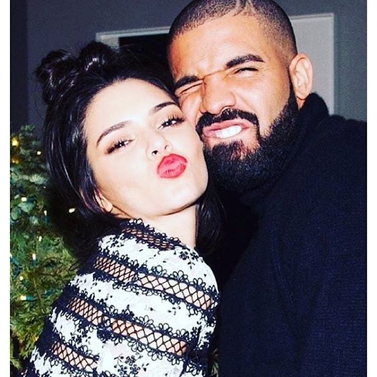 Kendall Jenner and Drake posing together at a Christmas party