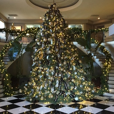 A large Christmas tree in the hallway of Kris Jenner's house