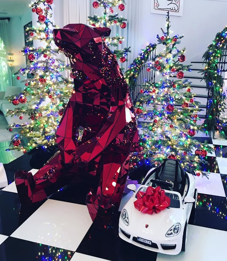 A large red bear sculpture in Kris Jenner's house during Christmas