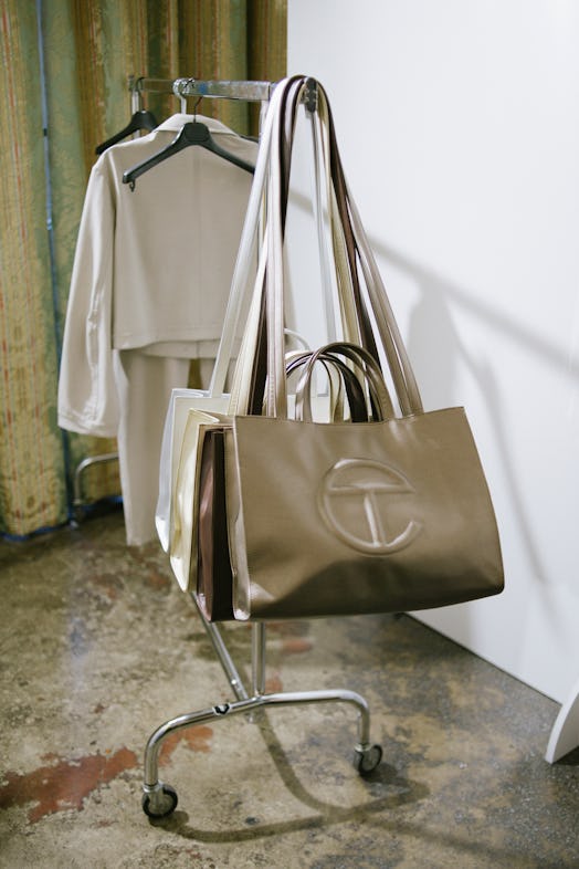 Telfar signature leather bags in different colors on the hanger