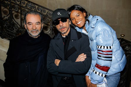 Remo Rufini posing with a man and woman at the launch of 1 Moncler Pierpaolo Piccioli at the Picasso...