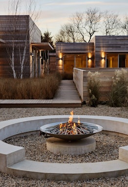 A fire pit in front of the Shou Sugi Ban House
