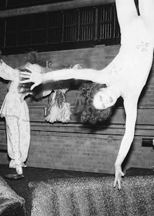 Dancers at the Studio 54’s New Year’s Eve Party, with one hanging from the ceiling 