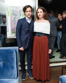 Noah Baumbach and Sara Moonves standing and posing at W Magazine’s Best Performances Party