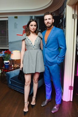 Ana De Armas and Chris Evans standing and posing at W Magazine’s Best Performances Party