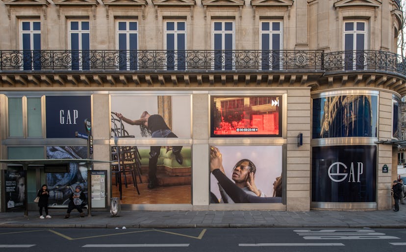 The windows of Gap store decorated with banners that advertise their partnership with Telfar.