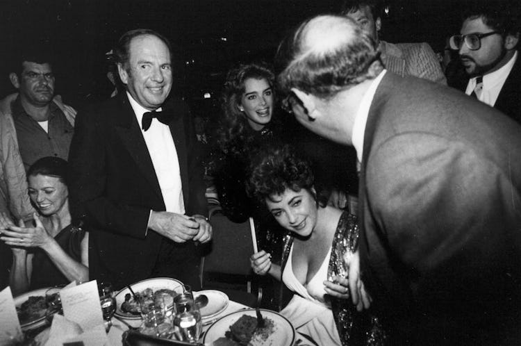 Elizabeth Taylor, Brooke Shields, and Victor Luna together during New Year’s Eve at the Hilton Hotel...