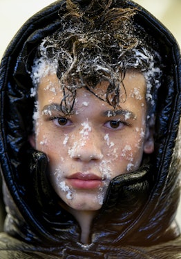 Closeup of a boy face with snow