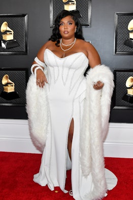 Lizzo wearing a white gown by Versace at the Grammy Red Carpet