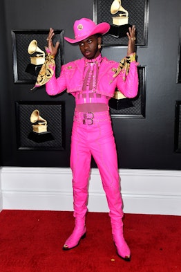 Lil Nas X in a pink suit and hat by Versace at the Grammy Red Carpet