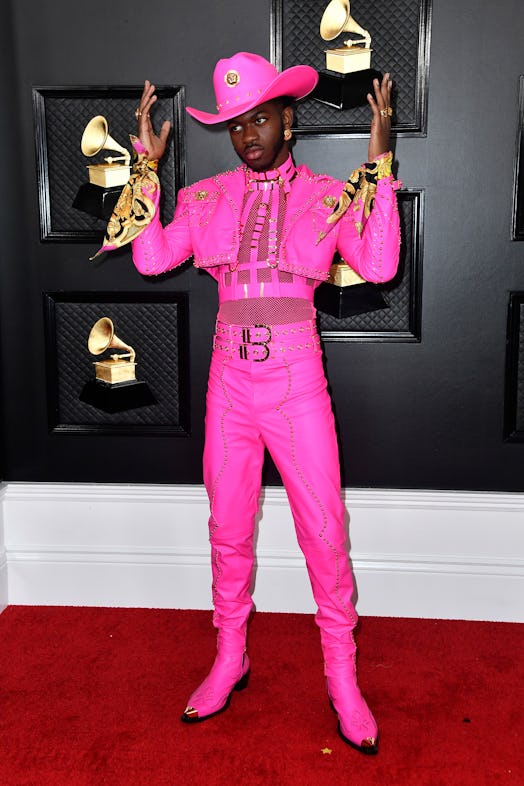 Lil Nas X in a pink suit and hat by Versace at the Grammy Red Carpet