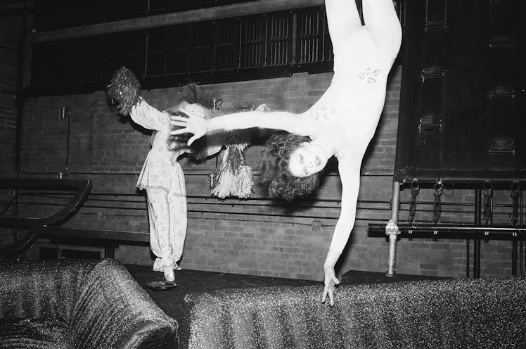 Dancers at the Studio 54’s New Year’s Eve Party hanging on a ceiling 