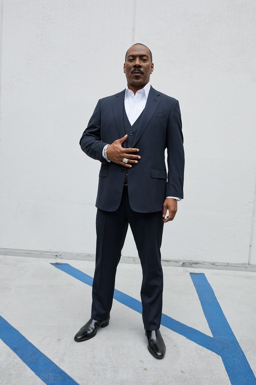 Eddie Murphy posing in a formal suit