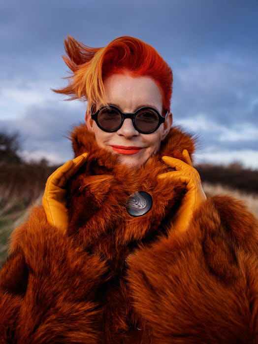 Sandy Powell posing in her own jacket and Paula Rowan leather gloves