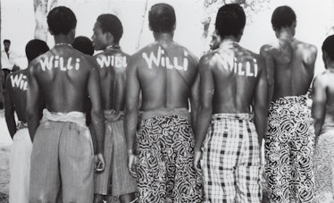 Théâtre National Daniel Sorano dancers on the set of Expedition with the word Willi written on their...