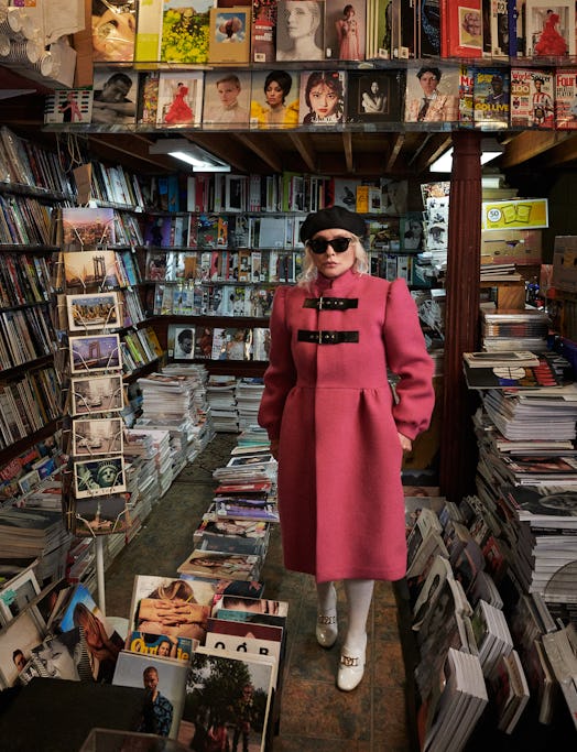 Debbie Harry in a pink Gucci coat, white Louis Vuitton shoes, a black Lola Hats beret and black Ray ...