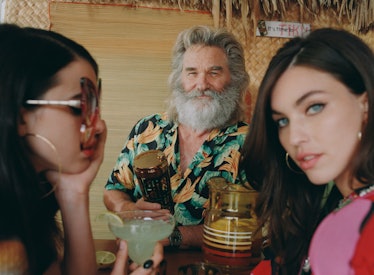 Randy Miller (Kurt Russell) pouring a drink for Pussycat and her sister