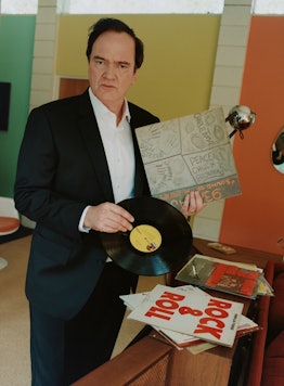Quentin Tarantino choosing a record for his party