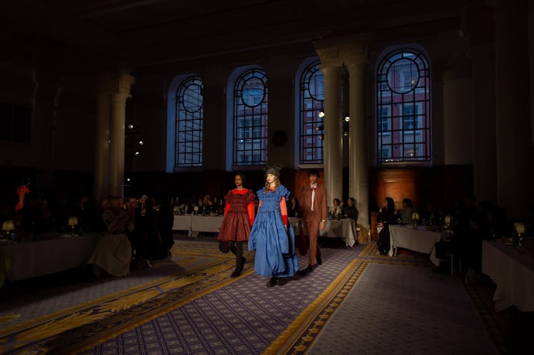 A model wearing a blue gown and a model wearing a red gown at Molly Goddard’s London Fashion Week Sh...