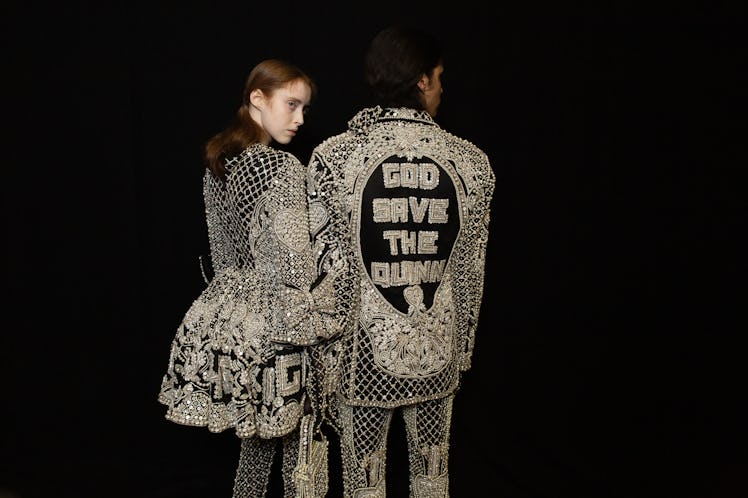 The back of two models sporting wearing diamond studded suits backstage at Richard Quinn‘s fall coll...