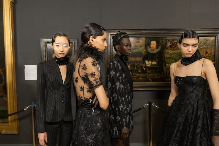 Models wearing black outfiits in backstage at the Erdem fall 2020 show