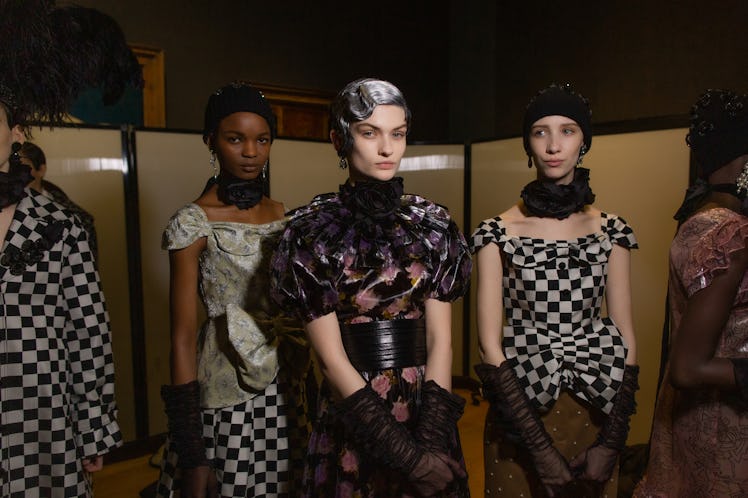 Three female models standing in backstage at the Erdem fall 2020 show