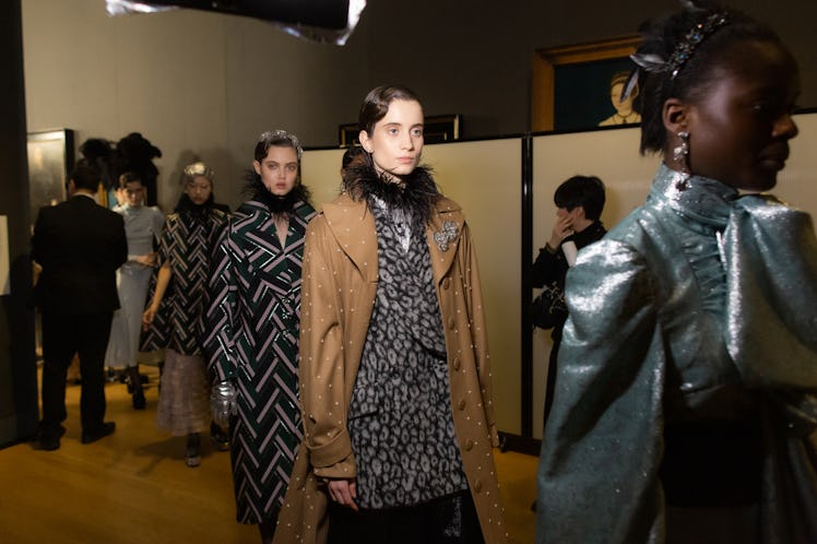 Four models walking in backstage at the Erdem fall 2020 show