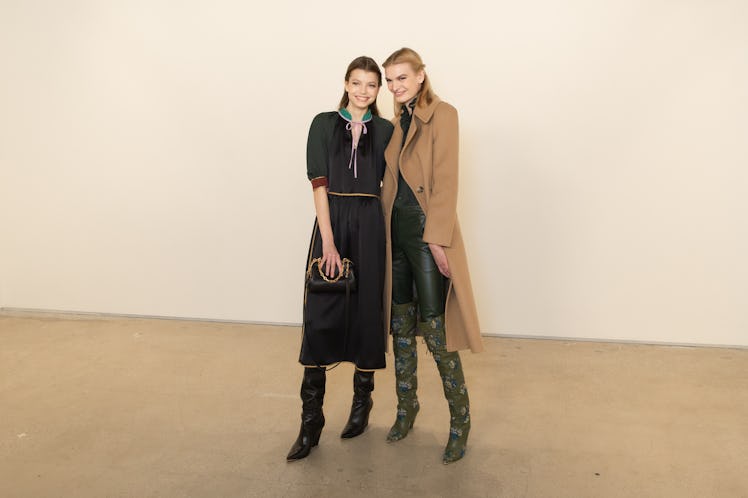 Two models posing hugged for a photo at the Tory Burch FW20 during New York Fashion Week