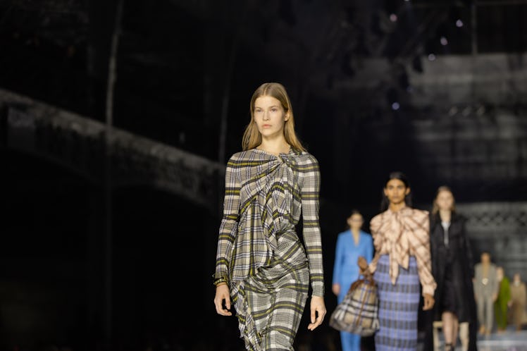 A model wearing a grey-brown checked jumpsuit at the Burberry Fall 2020 show