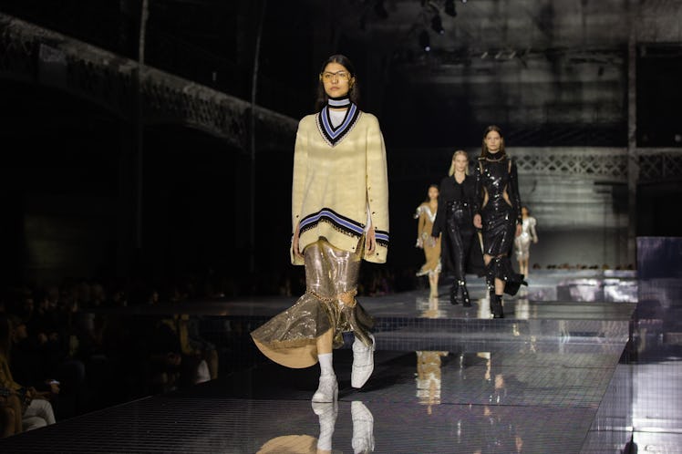 A model in a beige-black sweater and a beige sequin skirt at the Burberry Fall 2020 show