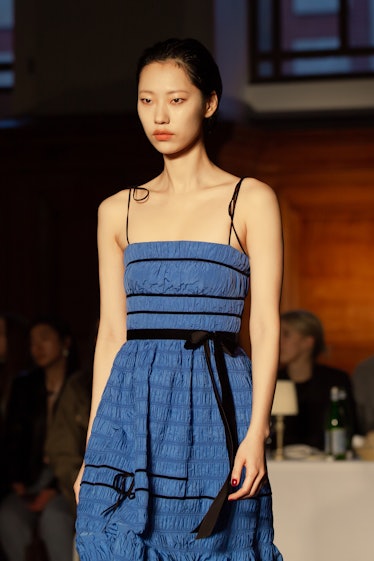 A model in a blue-black dress at Molly Goddard’s London Fashion Week Show