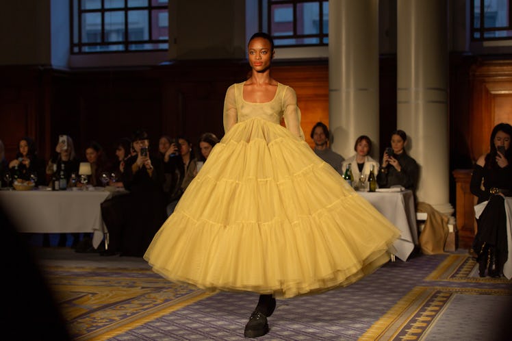 A model in a beige frill tulle dress at Molly Goddard’s London Fashion Week Show
