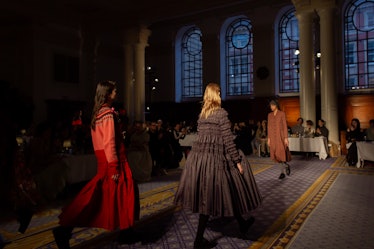 A model in a black dress and a model in a red dress at Molly Goddard’s London Fashion Week Show