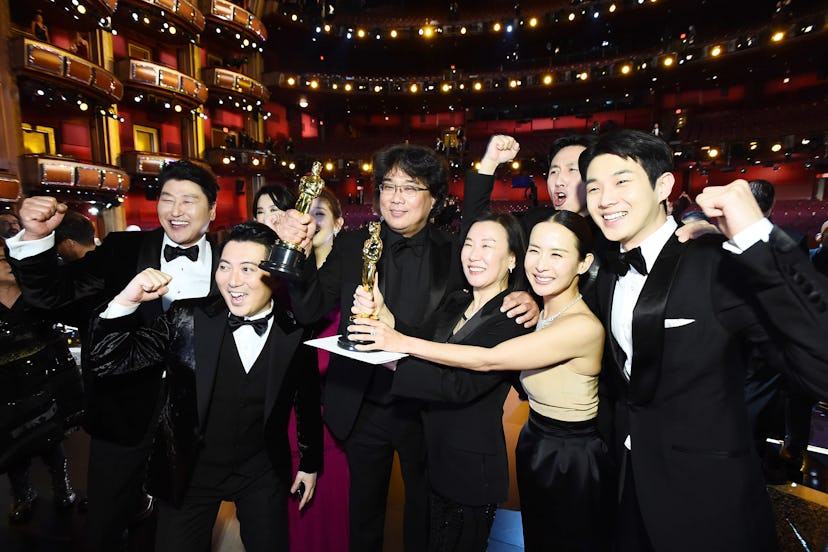 The Parasite team posing with their Oscar trophies