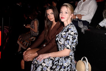 Emily Ratajkowski and Sydney Sweeney sitting next to each other at the Prada show during Milan Fashi...