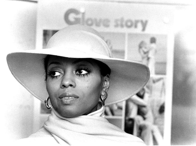 Diana Ross wearing a white hat in a Mahogany scene