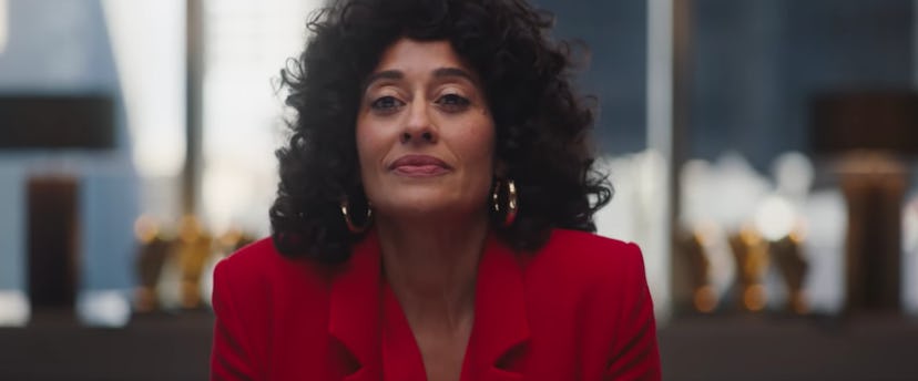 Tracee Ellis Ross wearing a red blazer and hoop earrings in The High Note trailer