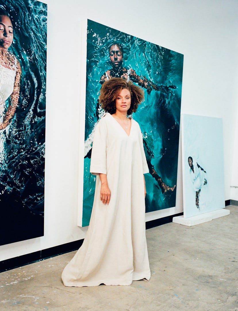 Ta-Nehisi Coates in a white, long, loose, v-neck dress 