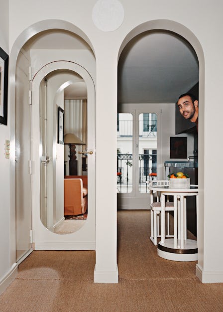 Fabrizio Casiraghi peeking from behind a wall in his house