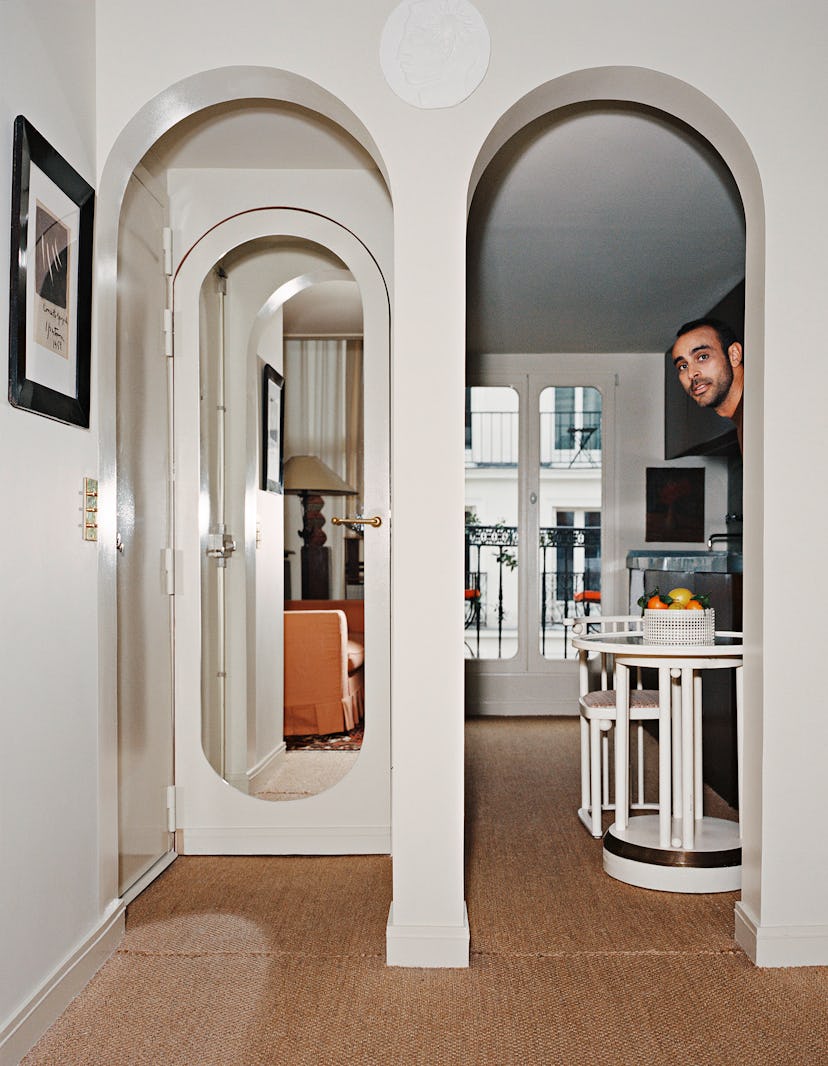 Fabrizio Casiraghi peeking from behind a wall in his house
