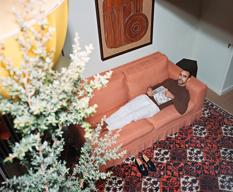 Casiraghi lying on a sofa in his living room 