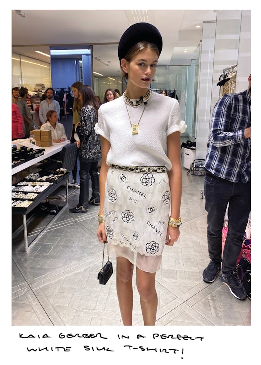 Kaia Gerber in a white shirt and a white tulle skirt by Chanel